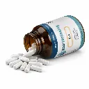 Spilled wellness capsules on white surface.webp